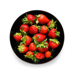 Berries of organic strawberries in a black round plate isolated on white background, top view.