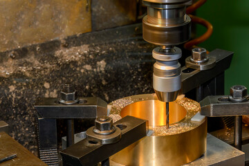 The drilling process on NC milling machine with brass material.