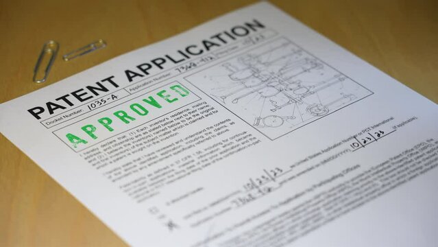 A patent application document form gets approved. Data on form is fictional.  	