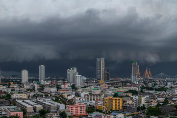 A heavy storm with rain and dramatic atmosphere clouds can be a sight to behold over a city center.