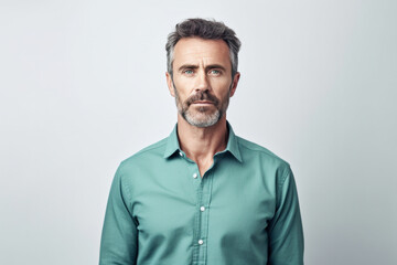 Fototapeta premium Middle Aged Caucasian Male Wearing Green Shirt on Gray Copy Space. Generative AI.