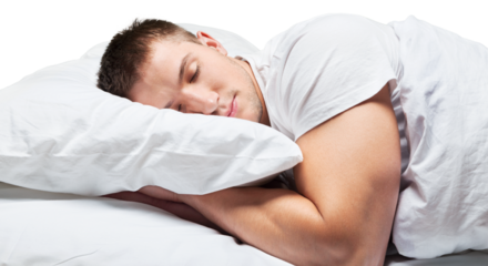 Young handsome man happy to sleep in the bed