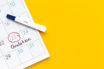 Female calendar with Ovulation day with pregnancy test