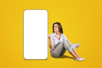 Happy young woman and big mobile phone