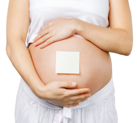 Belly of a young pregnant woman with a sticker