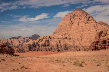 Fototapeta na wymiar Desert road in Wadi Rum valley in Jordan