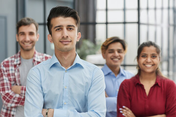 proud professional group diverse business people stand in office with their arms crossed