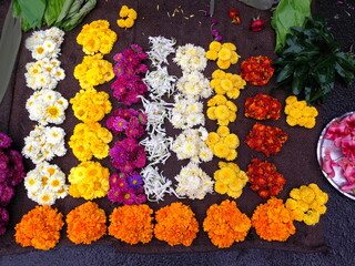 Systematically arranged flowers for selling by a flower selling vendor in Pune city, India.