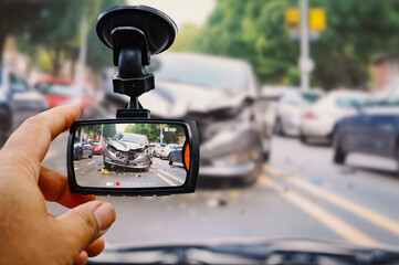 The human hand is touching camera on the car for check image car accident - obrazy, fototapety, plakaty
