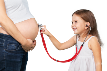 kid girl examining pregnant mother's tummy