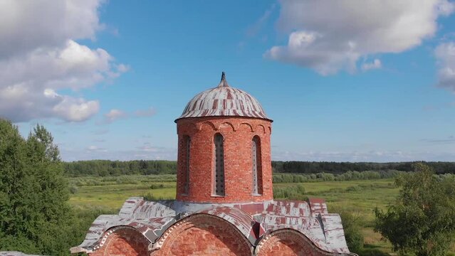 The old Orthodox Church of the Savior on Kovalev on the outskirts of Veliky Novgorod. The view from the drone on a sunny day.