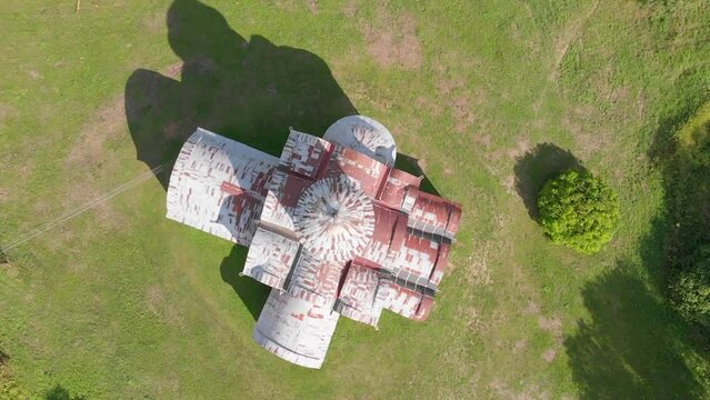 The old Orthodox Church of the Savior on Kovalev on the outskirts of Veliky Novgorod. The view from the drone on a sunny day.