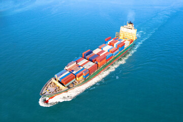 Top view of International Container ship loading, unloading at sea port, Freight Transportation, Shipping,  Vessel. Logistics, import export, Transportation. Global transport business.