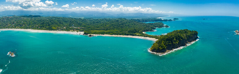 Fototapeta na wymiar Aerial view of Manuel Antonio National Park in Costa Rica. The best Tourist Attraction and Nature Reserve with lots of Wildlife, Tropical Plants and paradisiacal Beaches on the Pacific Coast.