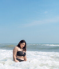 Portrait young woman asian chubby cute beautiful oneperson in bikini black sexy front viewpoint tropical sea beach white sand clean and bluesky background calm Nature ocean Beautiful wave water travel