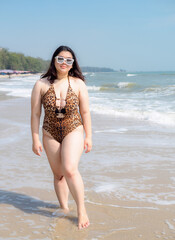 Fototapeta na wymiar Portrait young woman asian chubby cute beautiful oneperson in bikini brown sexy front viewpoint tropical sea beach white sand clean and bluesky background calm Nature ocean Beautiful wave water travel