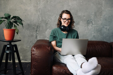 Productive Home Office: Young Woman Engaged in Laptop Work, Representing Work-from-Home,...
