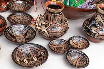 Foto op Canvas Pottery craft made by Quechua women from the Ecuadorian Amazon region, city Puyo. Small bowls and jug with a traditional design for everyday use and for communal ritual activities. © Iryna