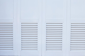 White wall with shutters. Textured background with space for text