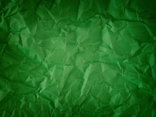 A crumpled green paper background