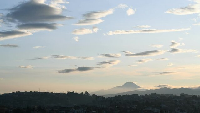 Cayambe volcano and Quito city landscape time lapse after sunrise with lenticular cloud formations, Ecuador.