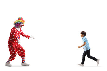 Boy running towards a clown
