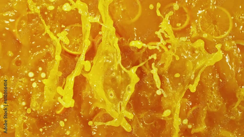 Aufkleber Super Slow Motion of Splashing Orange Juice. Filmed on High Speed Cinema Camera, 1000 fps. Abstract Liquid Background with Orange Slices. Speed Ramp Effect.