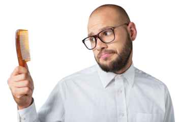 Desperate man with a comb for his baldness