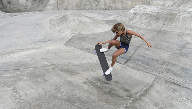 A girl rides and does tricks on a skateboard on the ramp of a skate park.