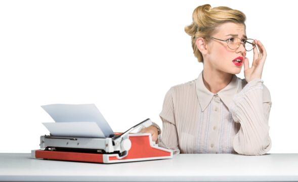 Beautiful young woman typing notes with a typewriter