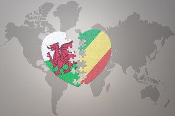 puzzle heart with the national flag of republic of the congo and wales on a world map background.Concept.