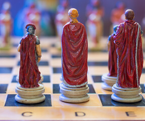 chess board with various pieces of Romans and Egyptians © Antonio