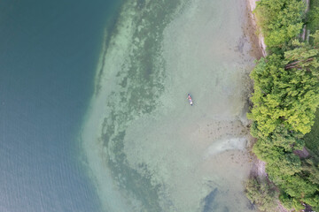 aerial footage of people kayak during sunset in the lake in Switzerland