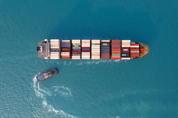 Fototapeta premium Top view Logistics and transportation of Container Cargo ship and Cargo plane with working crane bridge in shipyard at sunrise, logistic import export and transport industry background