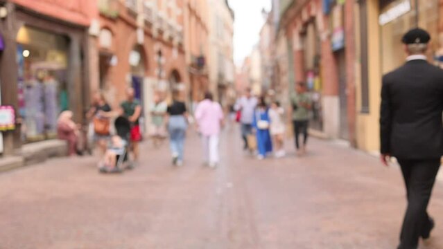 Street in Toulouse with defocussed people shopping