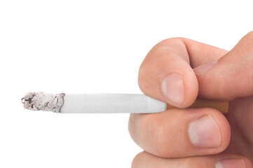 Human hand holds cigarettes, bad habits concept