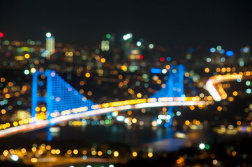 Fototapeta na wymiar Blurred and bokeh cityscape of Bosphorus Bridge in Istanbul