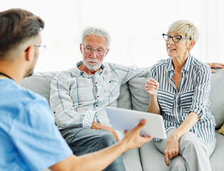 nurse doctor senior couple care caregiver help assistence retirement home nursing elderly man woman tablet technology