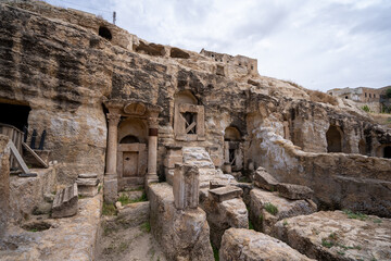 Exterior view of the 2000-year-old rock tombs from the Roman period in ancient Kizilkoyun Necropolis.