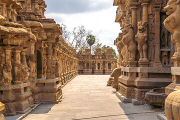 Temple corridor with its beautiful old sculptures of mythological lion and nandhi (bull god) at...