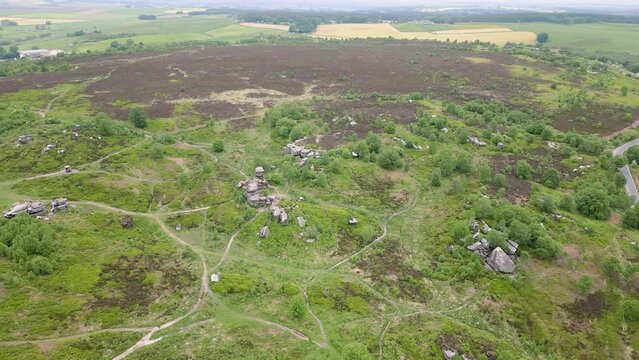 This aerial drone video shows the Brimham Rocks which are ancient rocks in Yorkshire Dales National Park, England. 