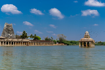 Udayarpalayam temple gopuram with the temple pond mandapan built thousands of years before. Temple...
