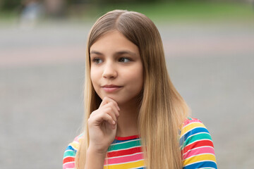 portrait of thinking teen girl. portrait of teen girl with blonde hair. portrait of teen girl