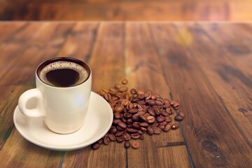 Tasty hot coffee in ceramic cup