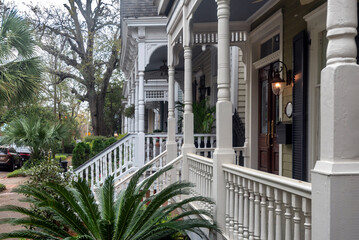 Charming colonial home facade and balconies in Savannah, Georgia on a cloudy day