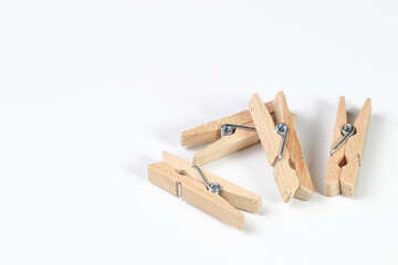Mini wooden clothespin collection isolated on white background. Clothespins in different positions...