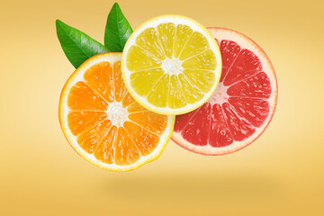 Stack of orange, lemon and grapefruit falling or flying.