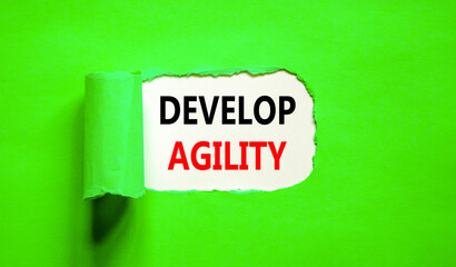 Develop agility symbol. Concept words Develop agility on beautiful white paper on a beautiful green background. Business, support and develop agility concept. Copy space.