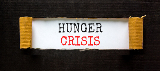 Hunger crisis symbol. Concept words Hunger crisis on beautiful white paper on a beautiful black background. Business, support and Hunger crisis concept. Copy space.