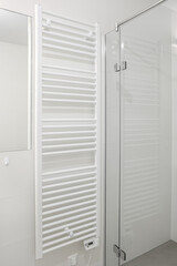 Towel rail on light wall in bathroom